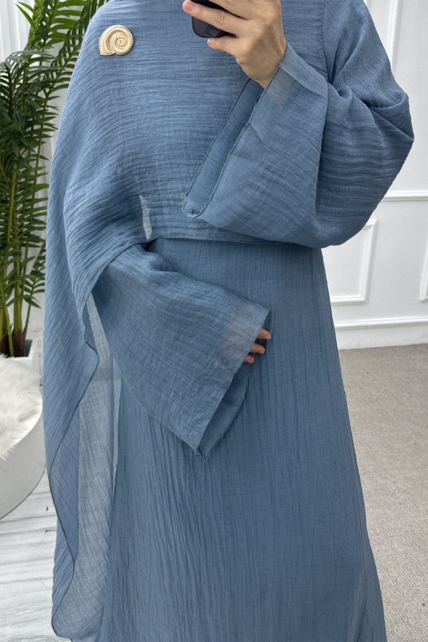 blue conservative dress FA6 Blue modest dress featuring a wrapped neckline with nipped waist and pleated details. Dresses from Teama Shop at Boksha