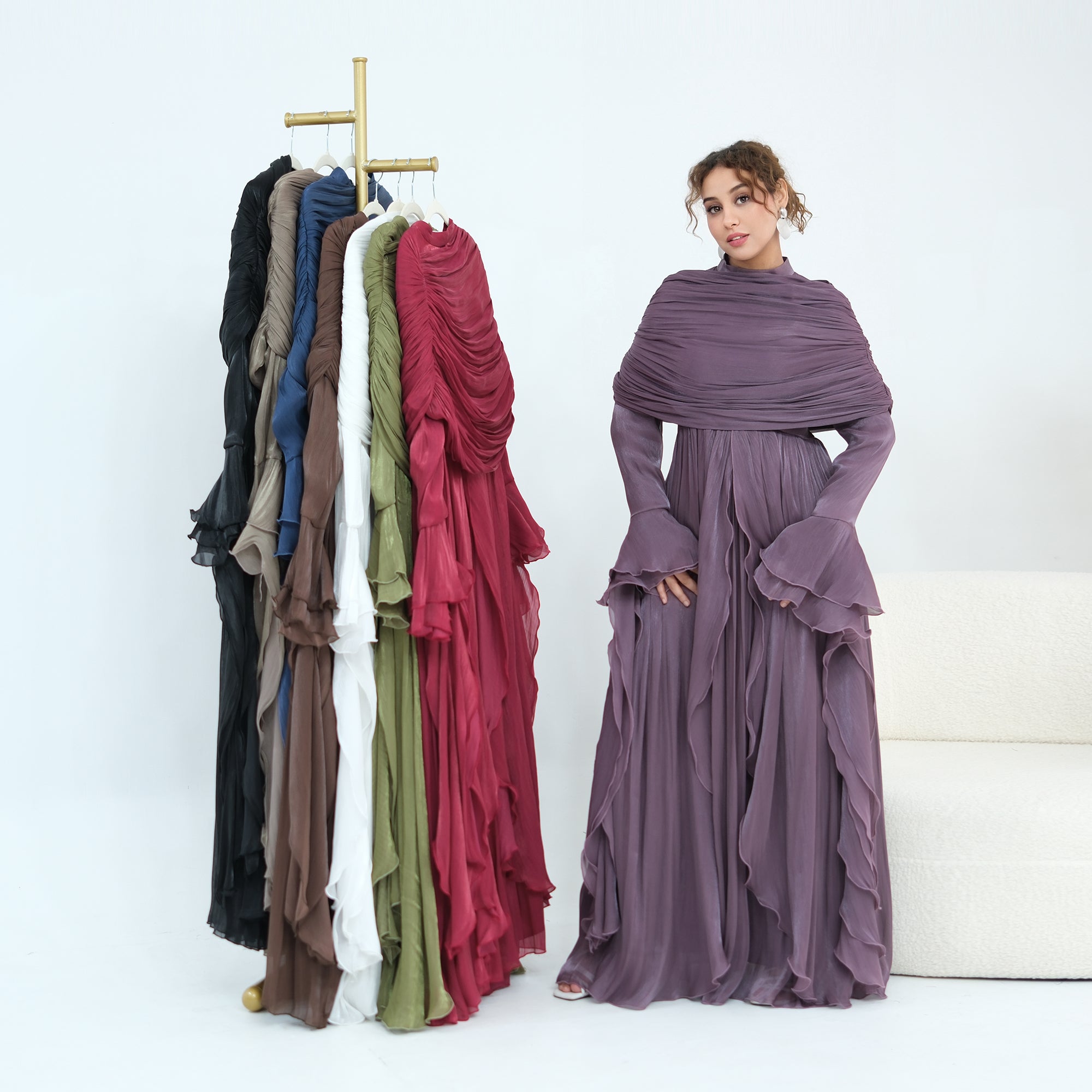 Double-layered dress with a waist-hugging design and a sleeveless vest, priced at 1169, without a headscarf