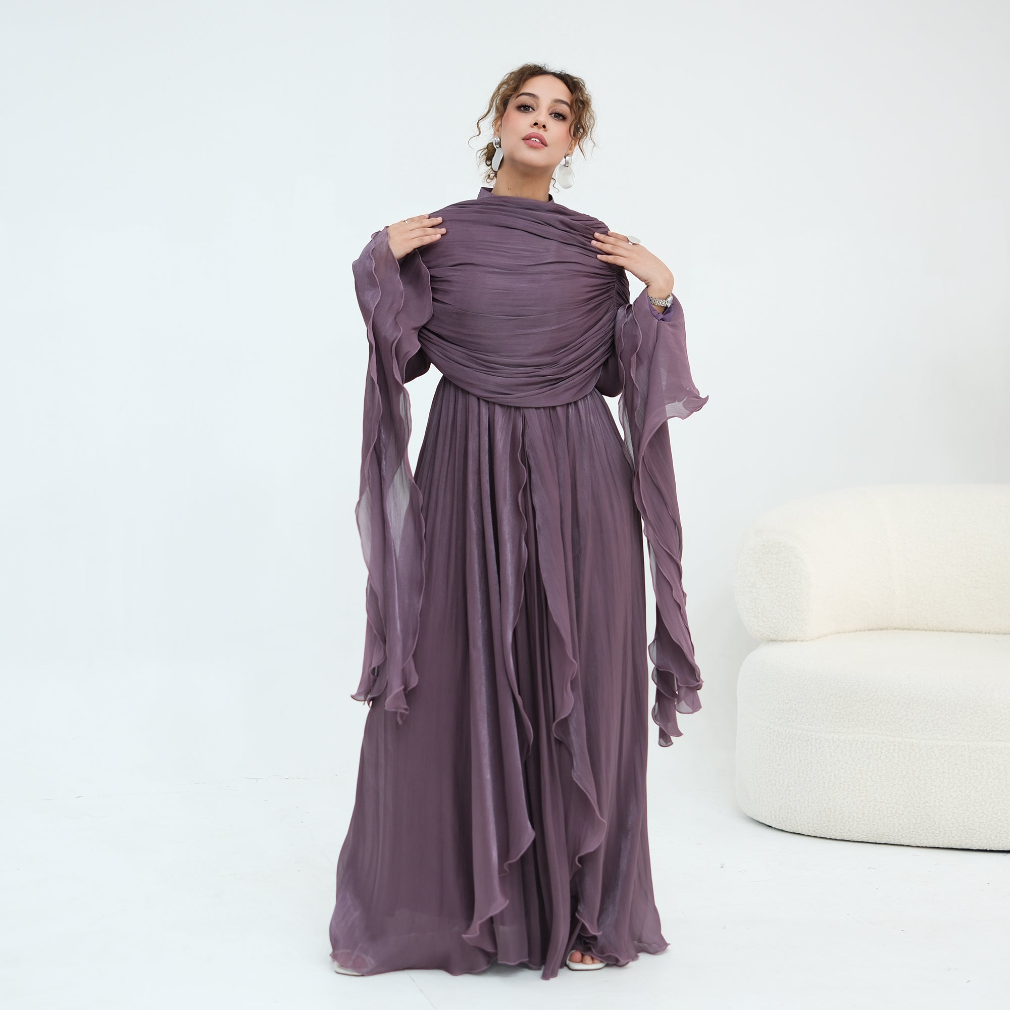 Double-layered dress with a waist-hugging design and a sleeveless vest, priced at 1169, without a headscarf