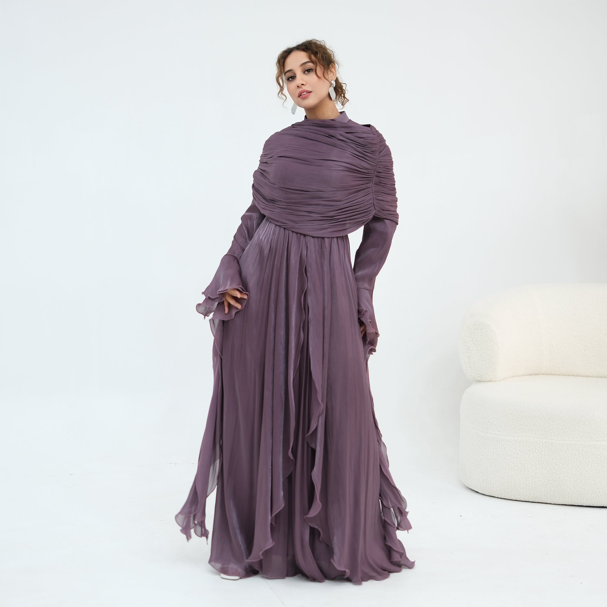 Double-layered dress with a waist-hugging design and a sleeveless vest, priced at 1169, without a headscarf