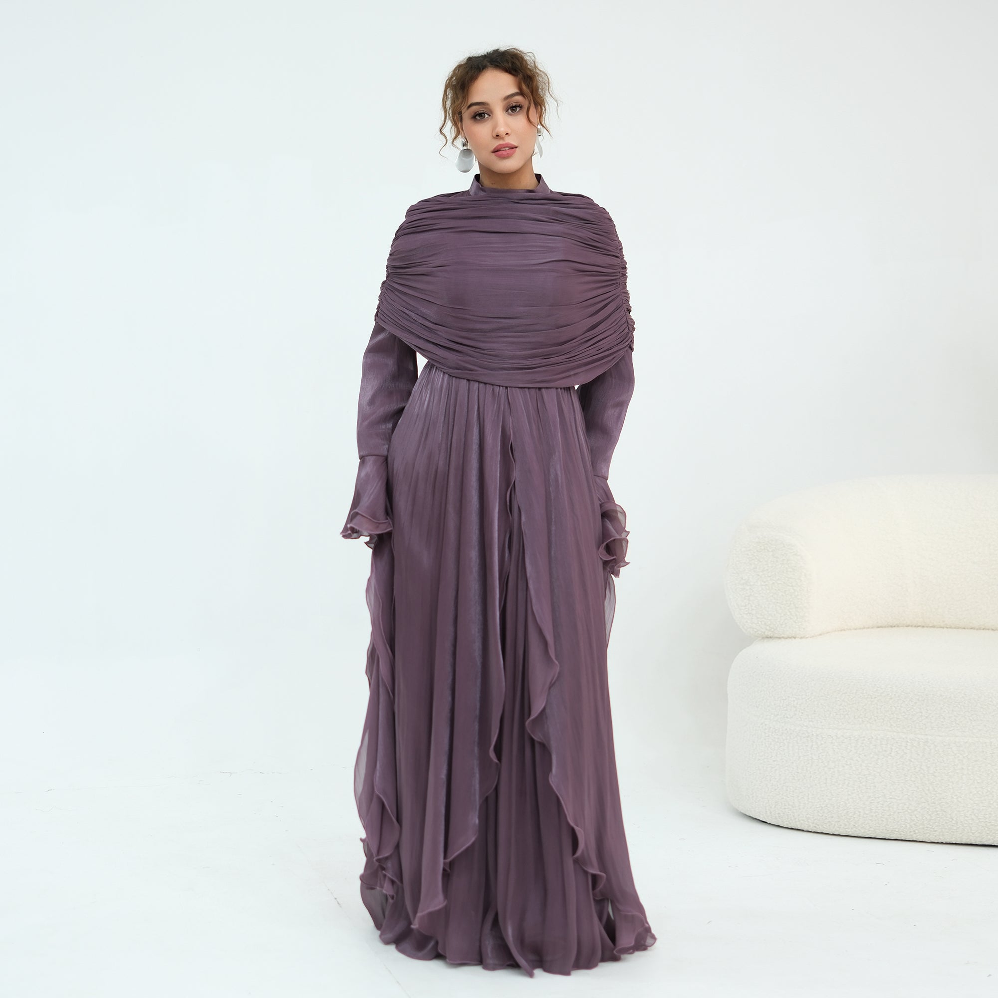 Double-layered dress with a waist-hugging design and a sleeveless vest, priced at 1169, without a headscarf