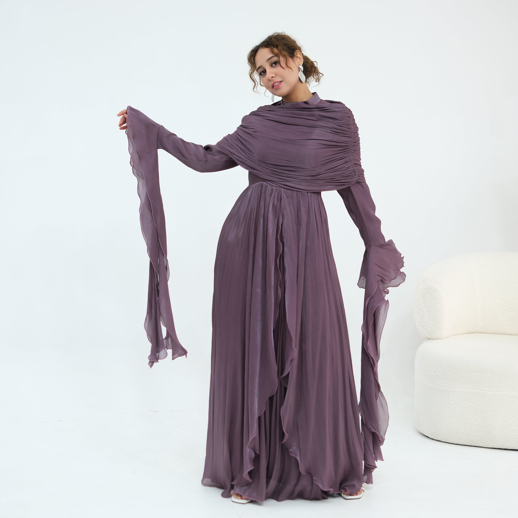 Double-layered dress with a waist-hugging design and a sleeveless vest, priced at 1169, without a headscarf