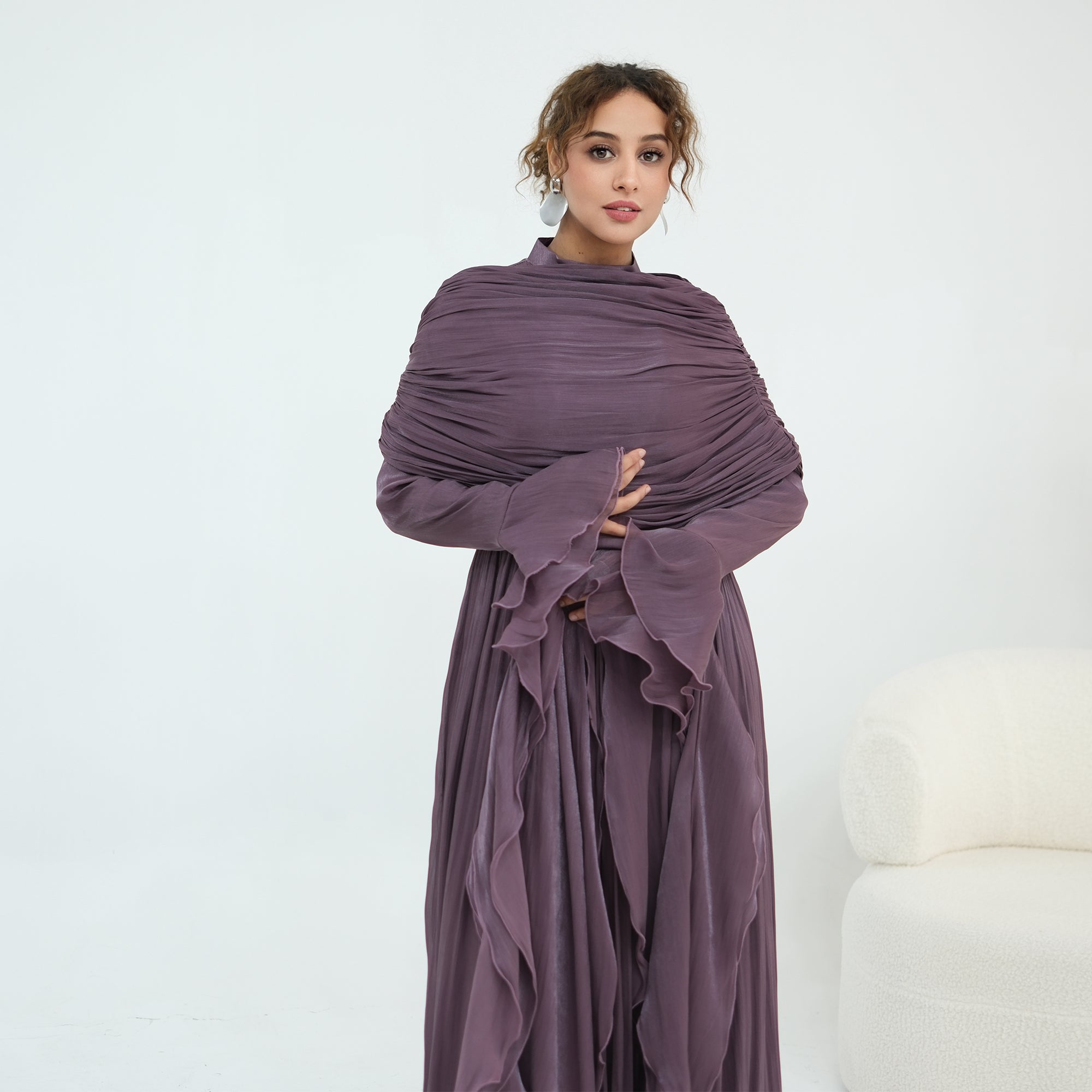 Double-layered dress with a waist-hugging design and a sleeveless vest, priced at 1169, without a headscarf