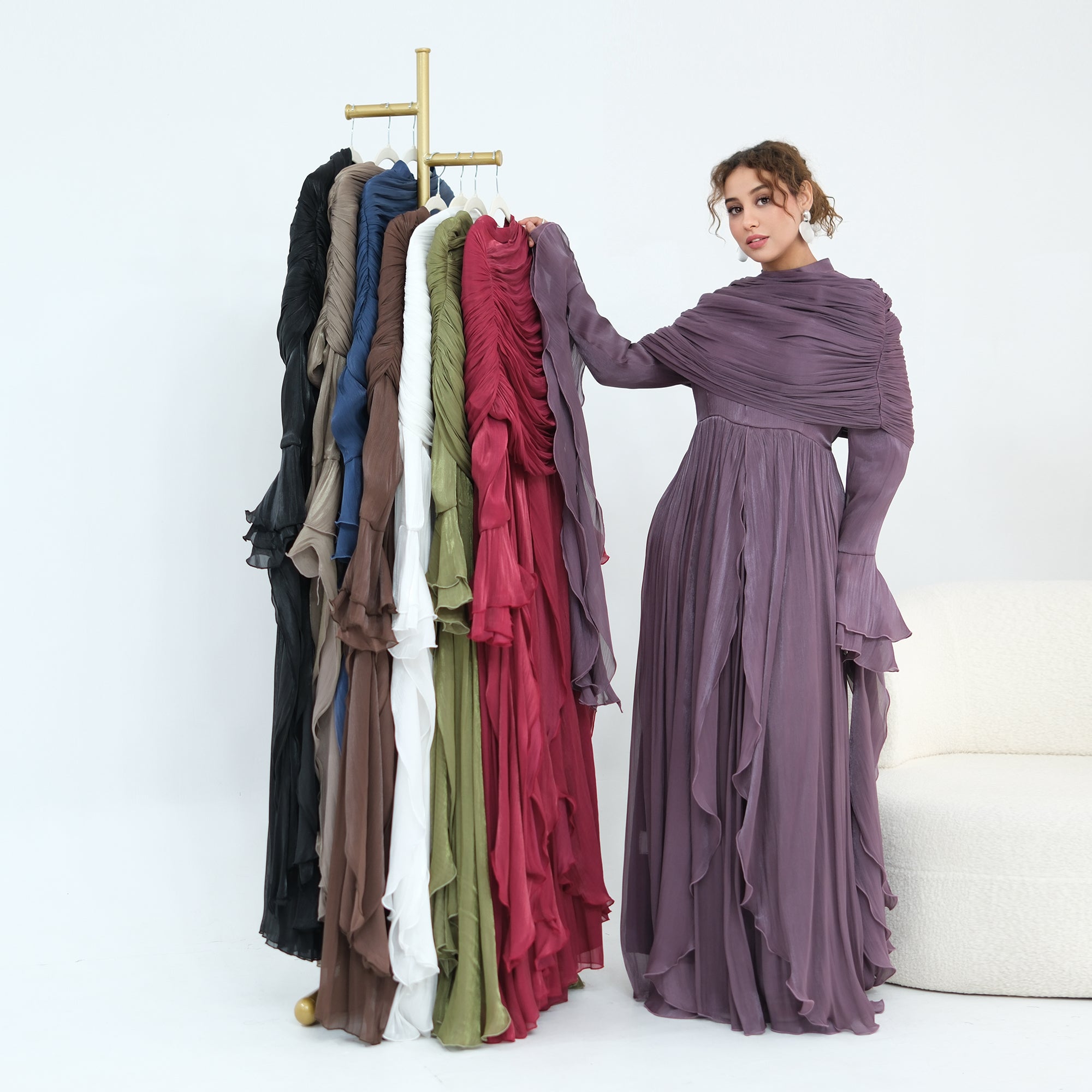 Double-layered dress with a waist-hugging design and a sleeveless vest, priced at 1169, without a headscarf