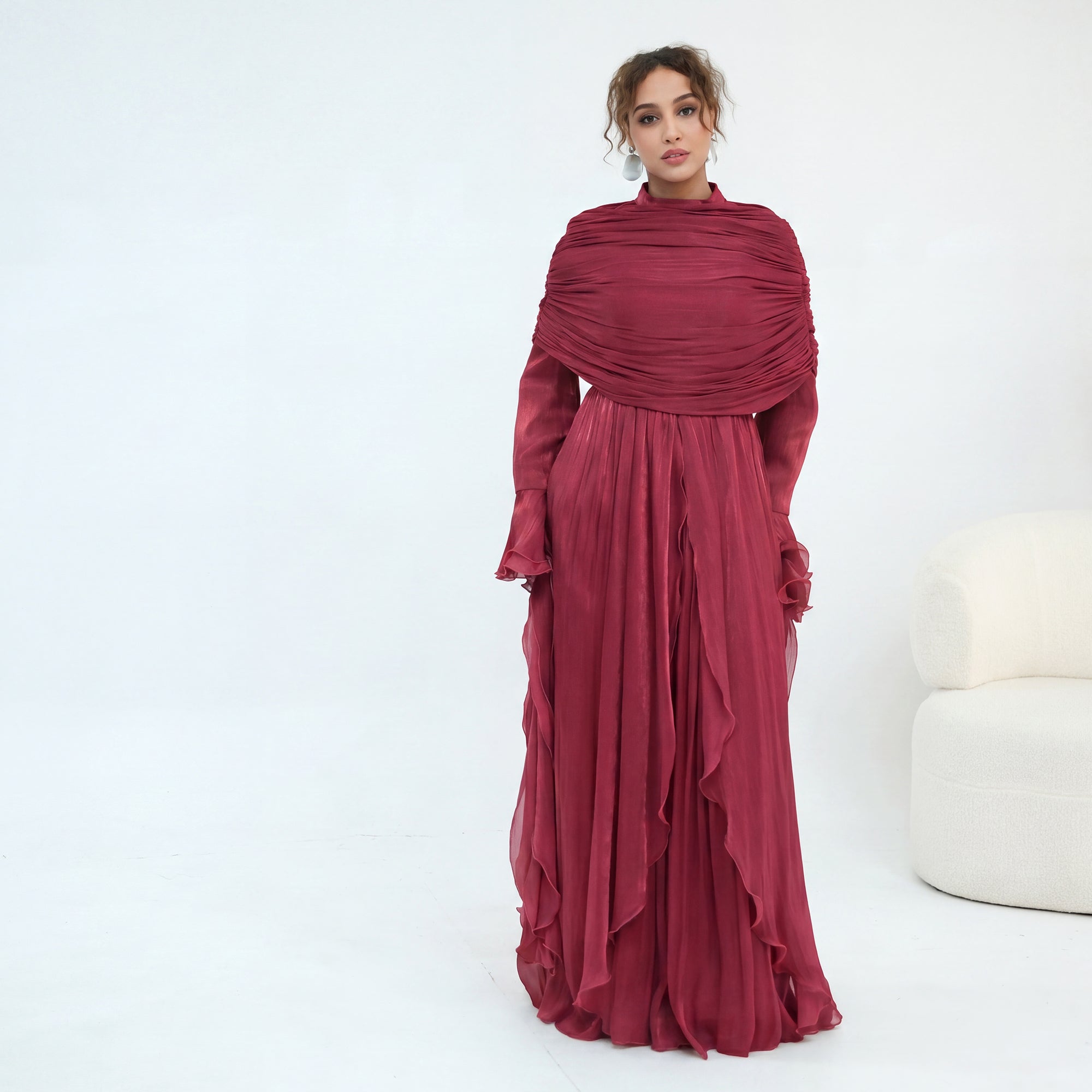 Double-layered dress with a waist-hugging design and a sleeveless vest, priced at 1169, without a headscarf