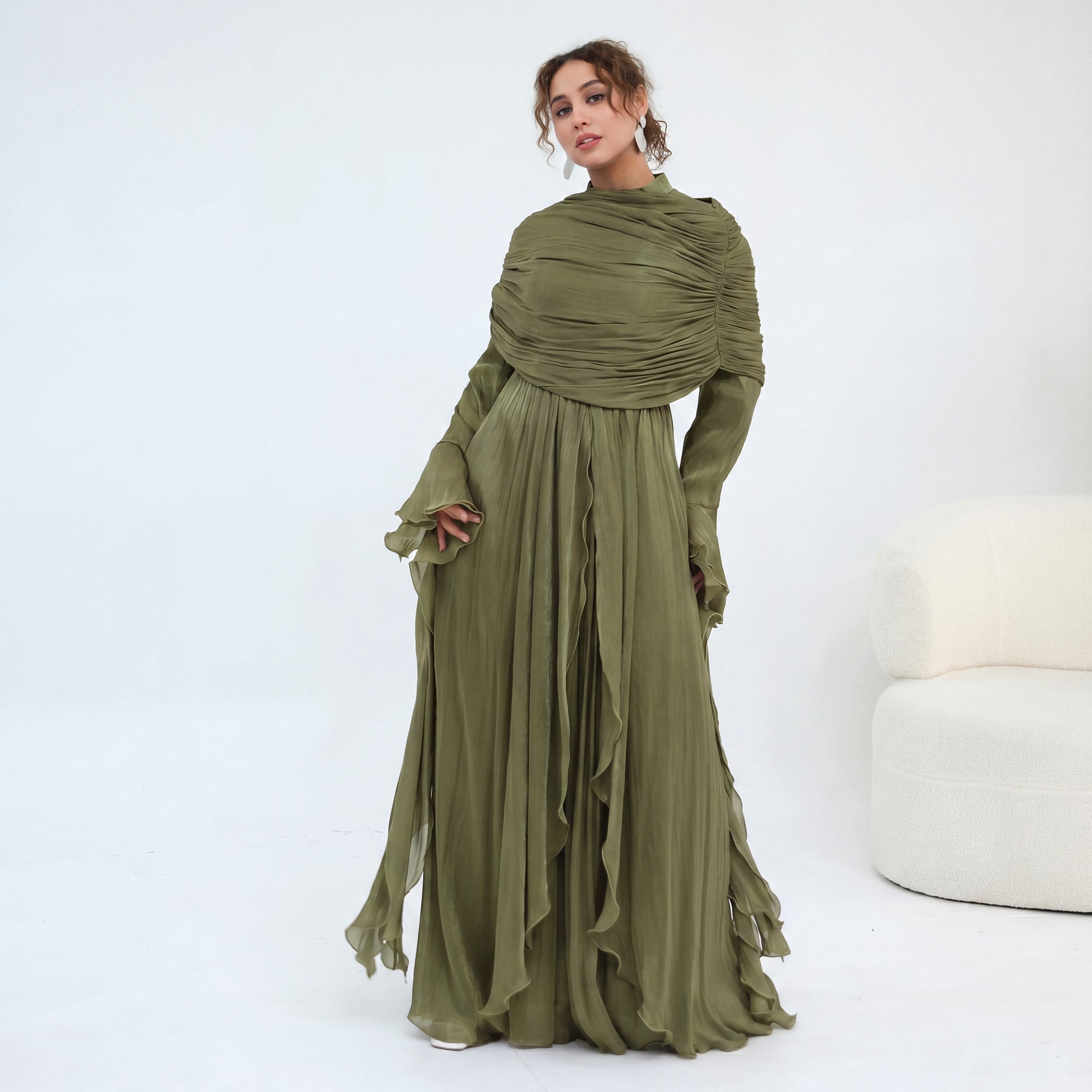 Double-layered dress with a waist-hugging design and a sleeveless vest, priced at 1169, without a headscarf