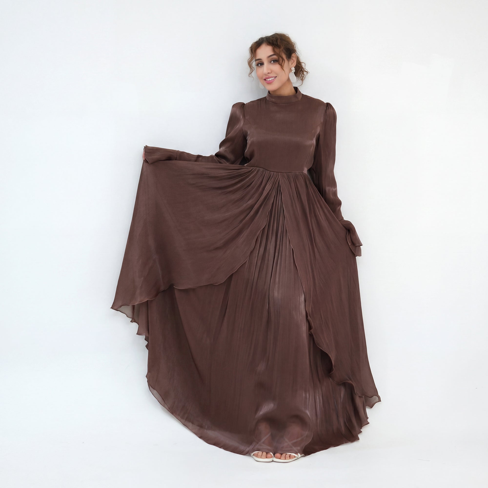 Double-layered dress with a waist-hugging design and a sleeveless vest, priced at 1169, without a headscarf