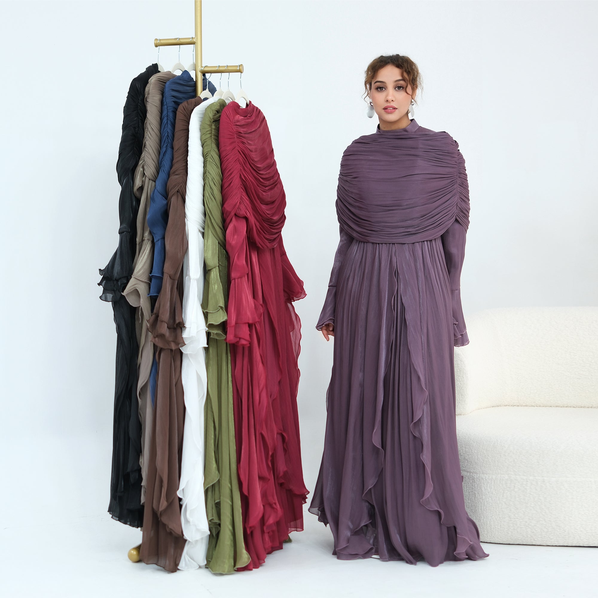 Double-layered dress with a waist-hugging design and a sleeveless vest, priced at 1169, without a headscarf