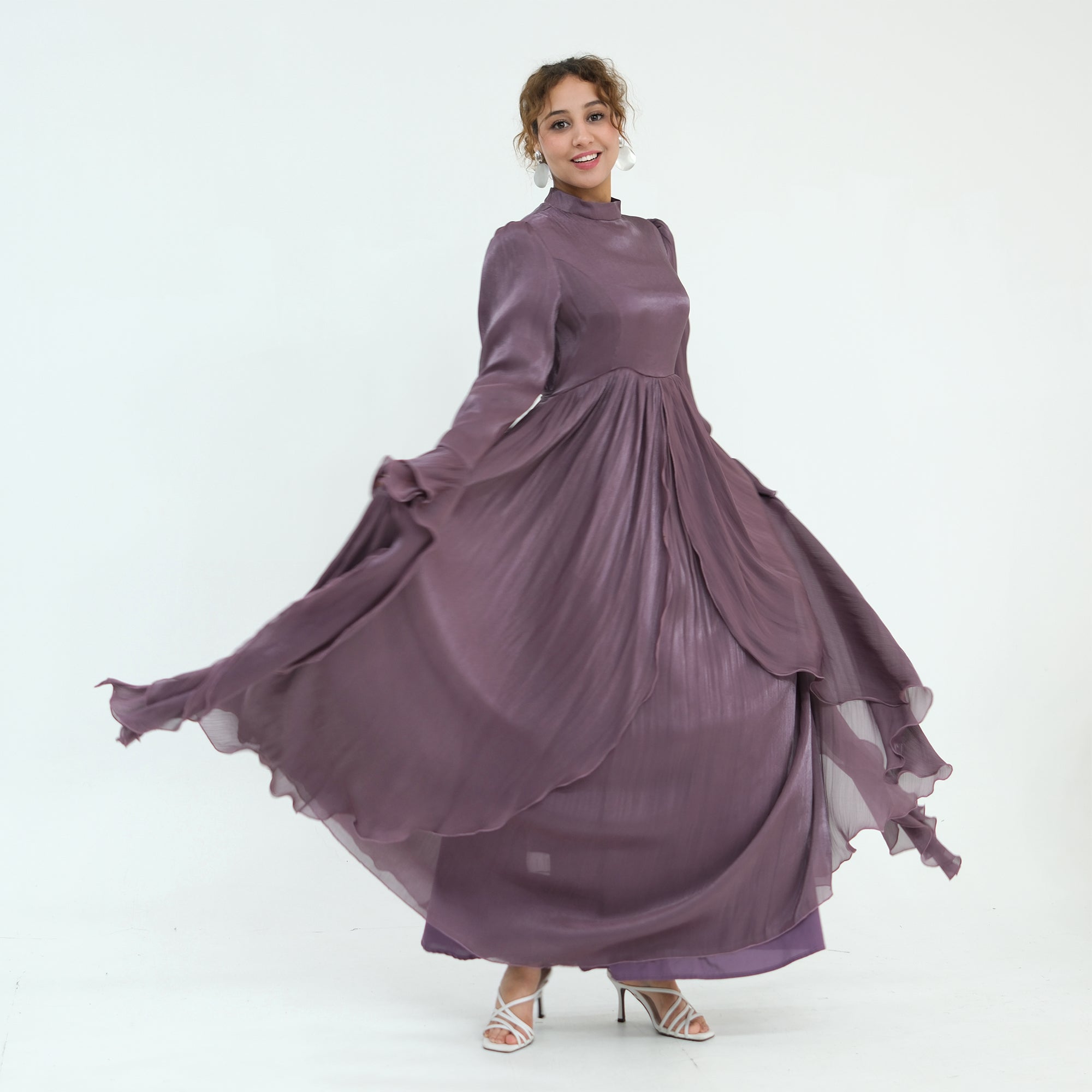 Double-layered dress with a waist-hugging design and a sleeveless vest, priced at 1169, without a headscarf