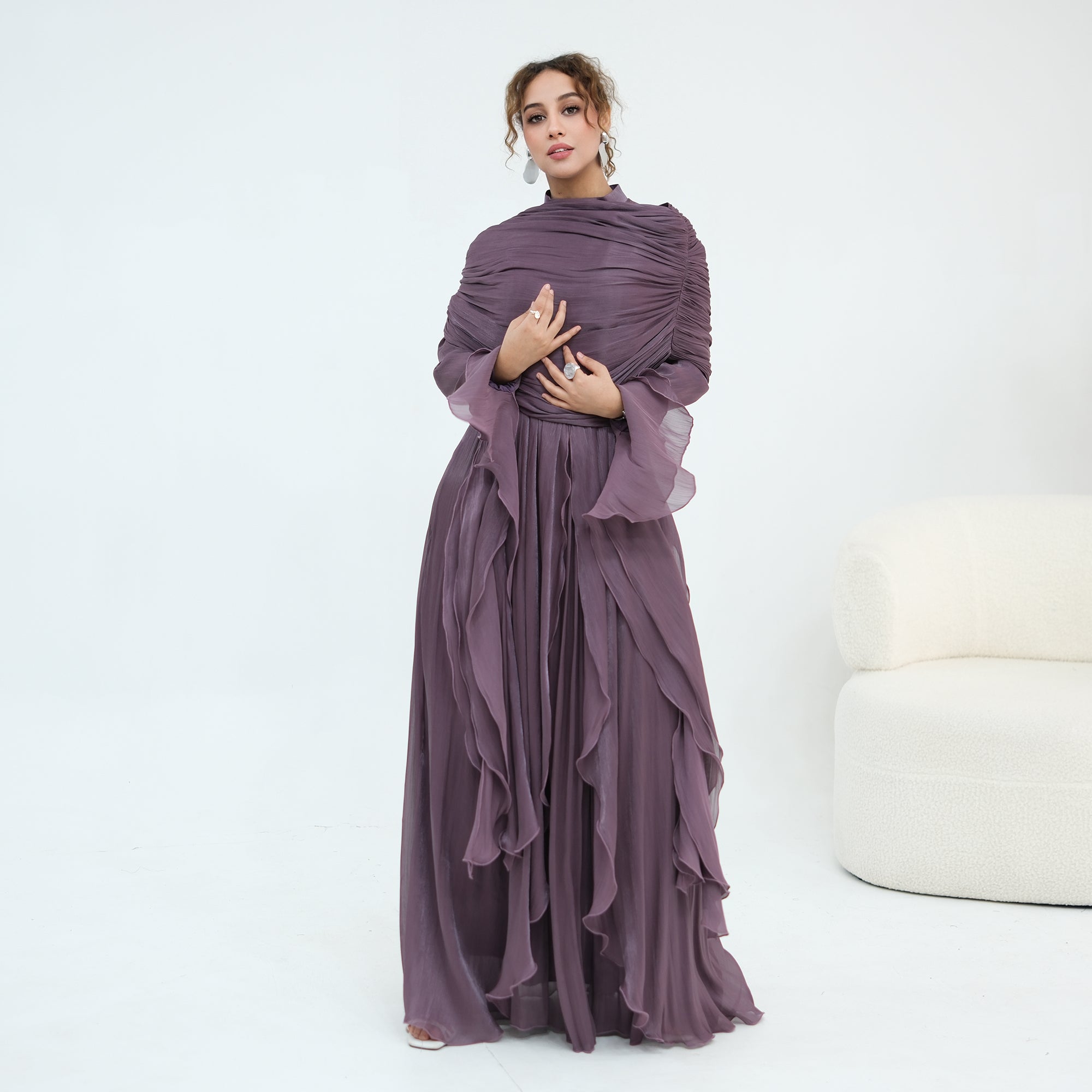 Double-layered dress with a waist-hugging design and a sleeveless vest, priced at 1169, without a headscarf