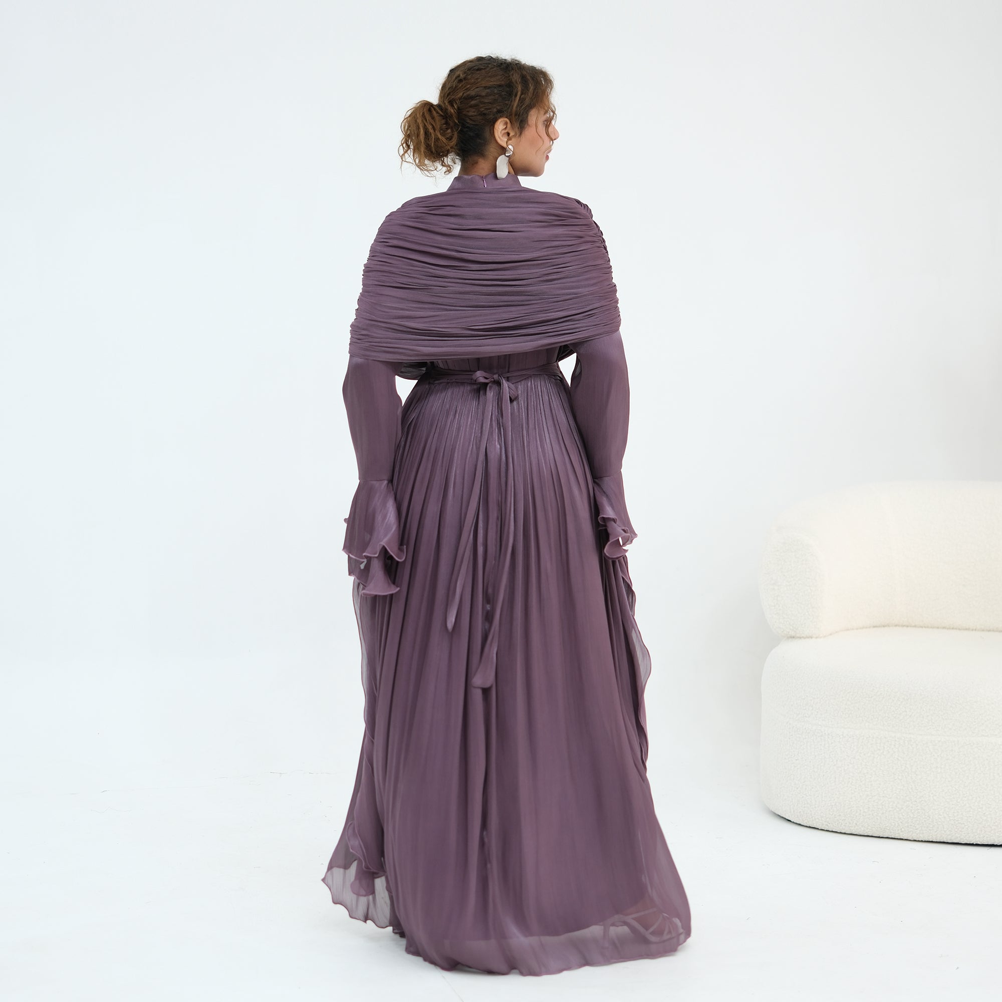 Double-layered dress with a waist-hugging design and a sleeveless vest, priced at 1169, without a headscarf