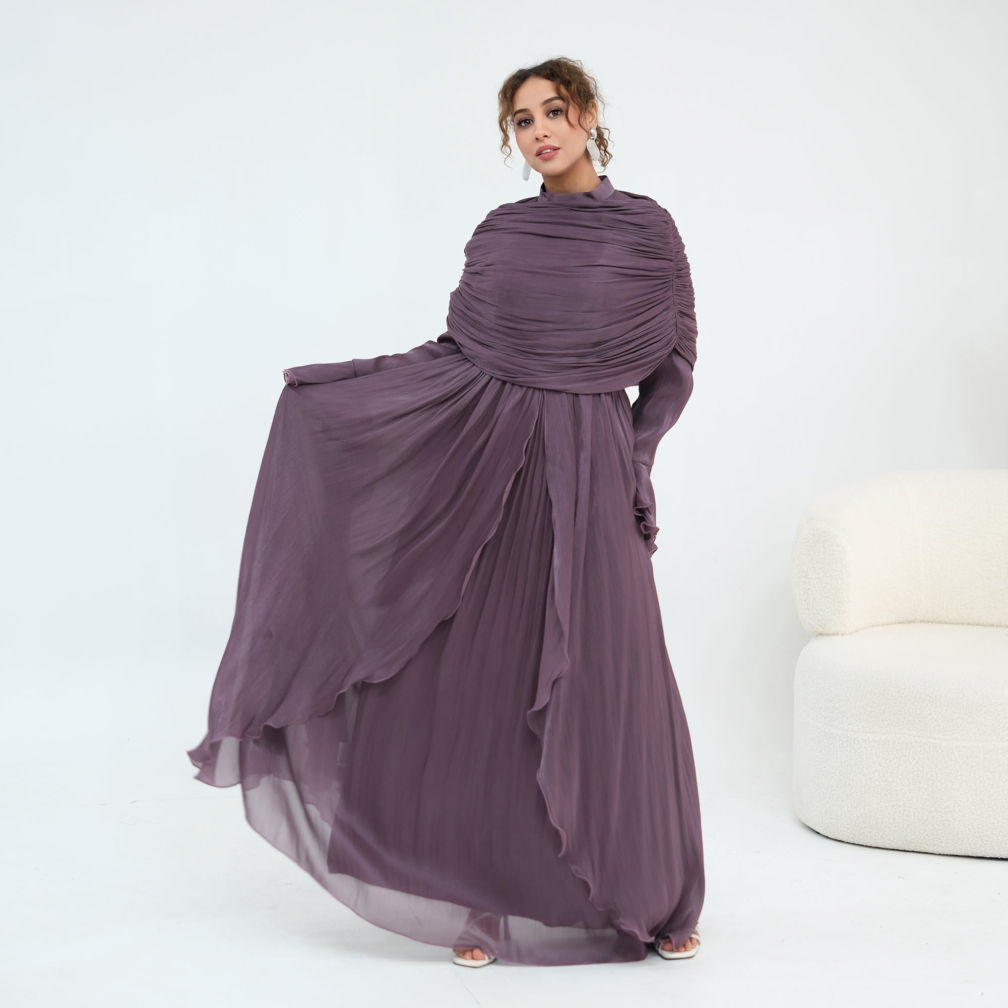 Double-layered dress with a waist-hugging design and a sleeveless vest, priced at 1169, without a headscarf