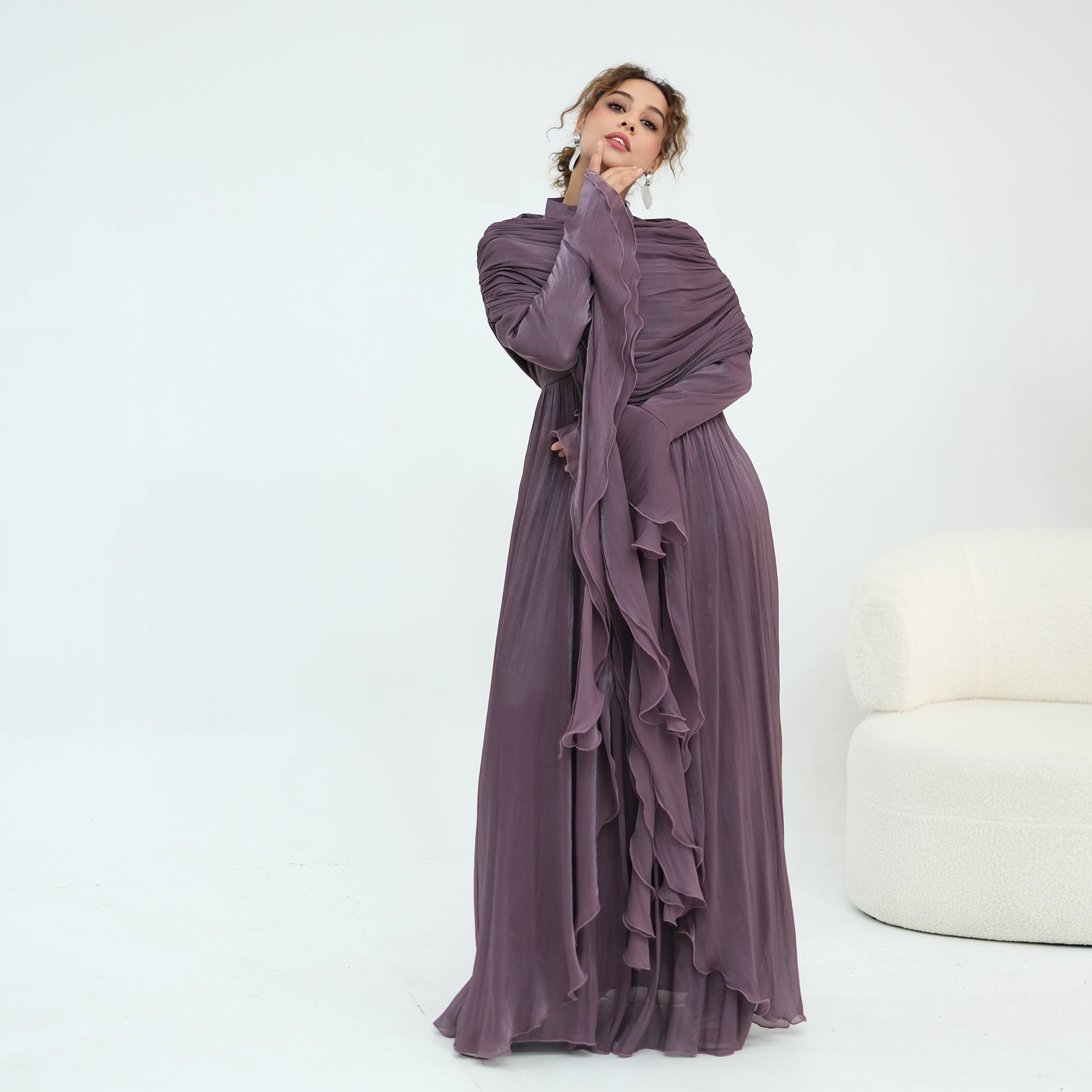 Double-layered dress with a waist-hugging design and a sleeveless vest, priced at 1169, without a headscarf