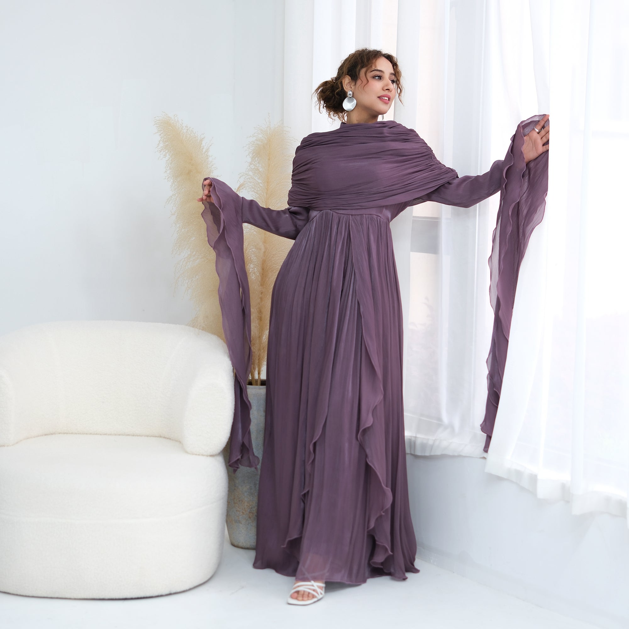 Double-layered dress with a waist-hugging design and a sleeveless vest, priced at 1169, without a headscarf