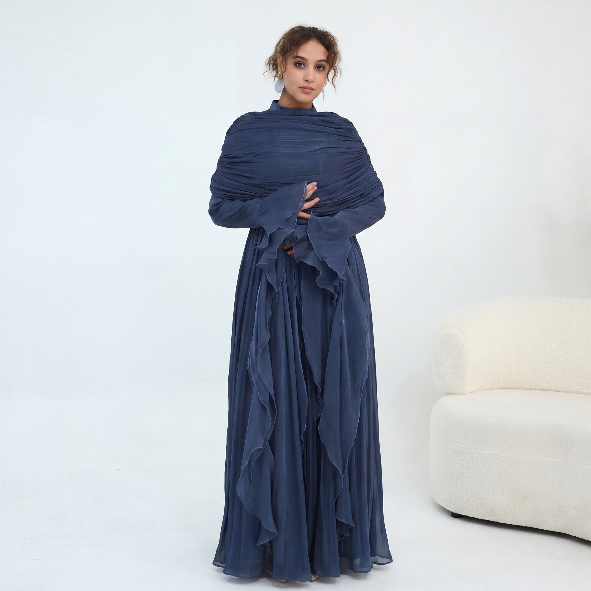 Double-layered dress with a waist-hugging design and a sleeveless vest, priced at 1169, without a headscarf