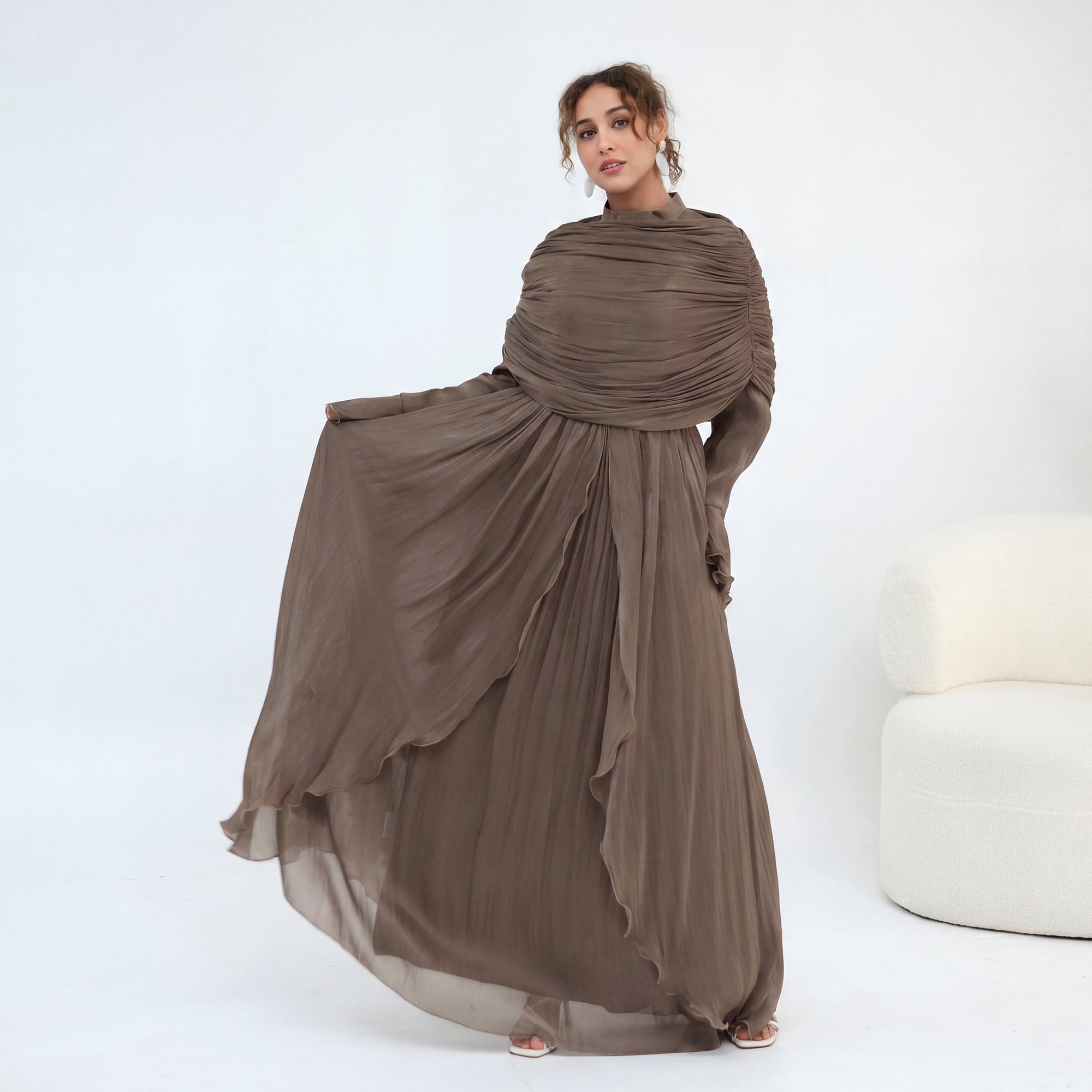 Double-layered dress with a waist-hugging design and a sleeveless vest, priced at 1169, without a headscarf