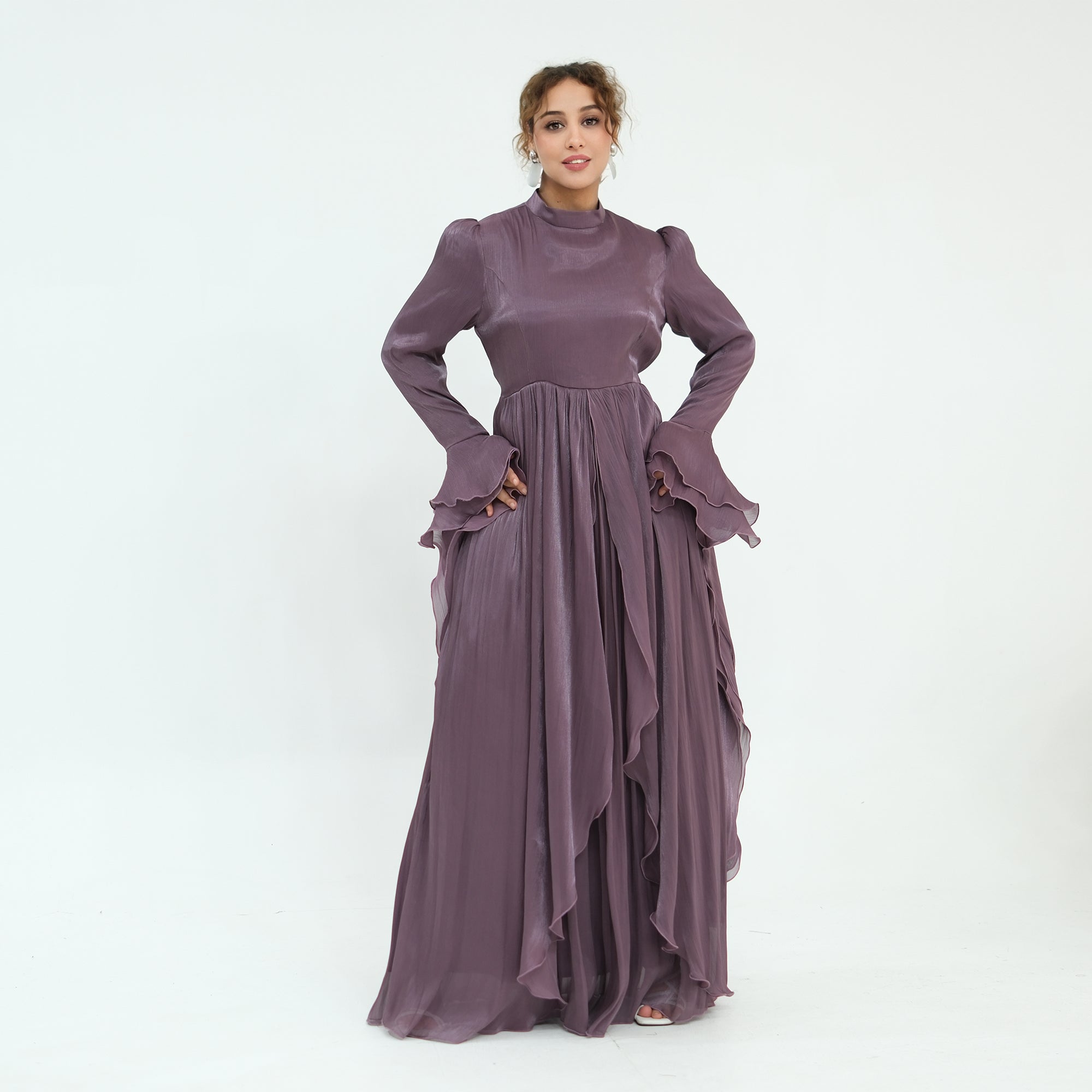 Double-layered dress with a waist-hugging design and a sleeveless vest, priced at 1169, without a headscarf
