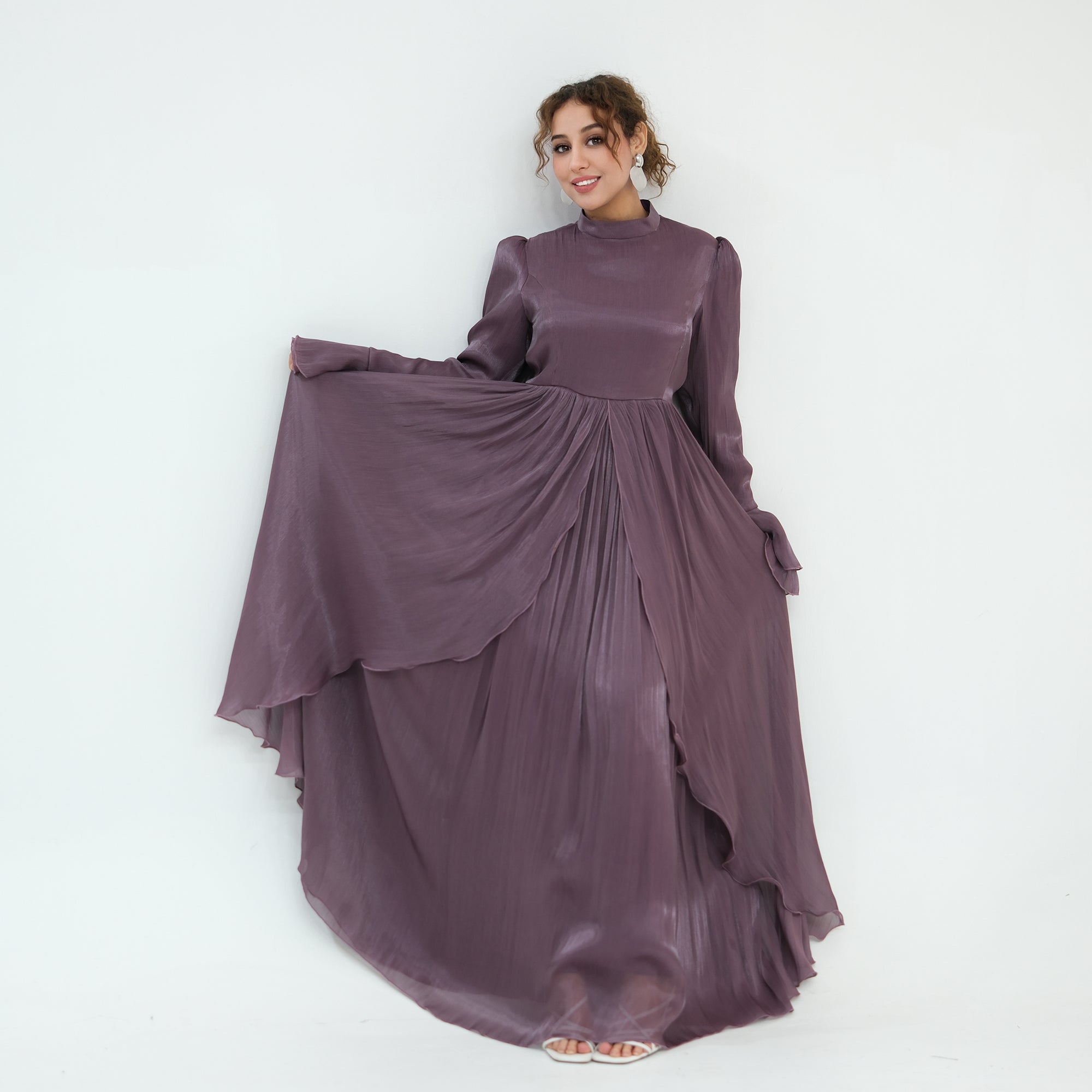 Double-layered dress with a waist-hugging design and a sleeveless vest, priced at 1169, without a headscarf