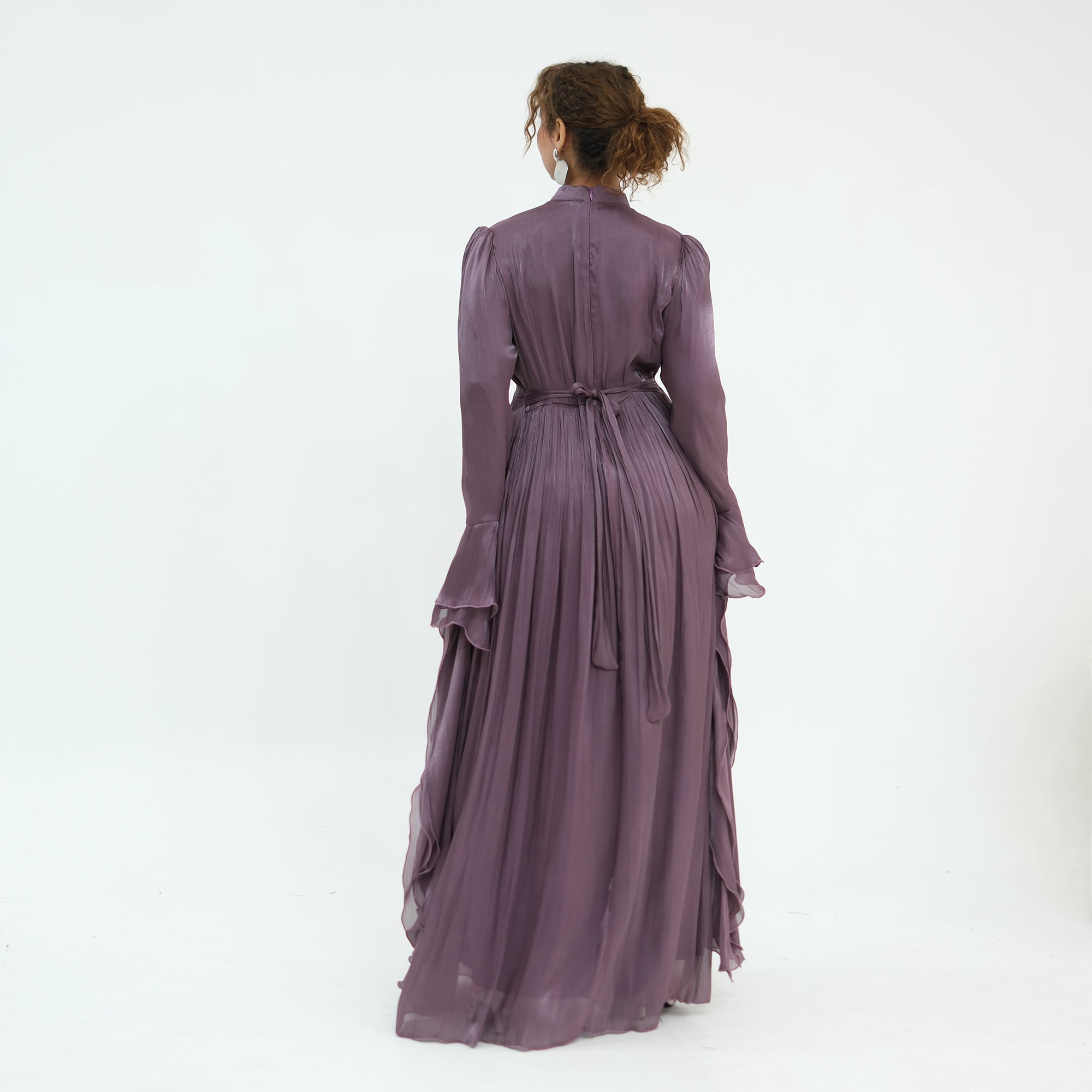 Double-layered dress with a waist-hugging design and a sleeveless vest, priced at 1169, without a headscarf