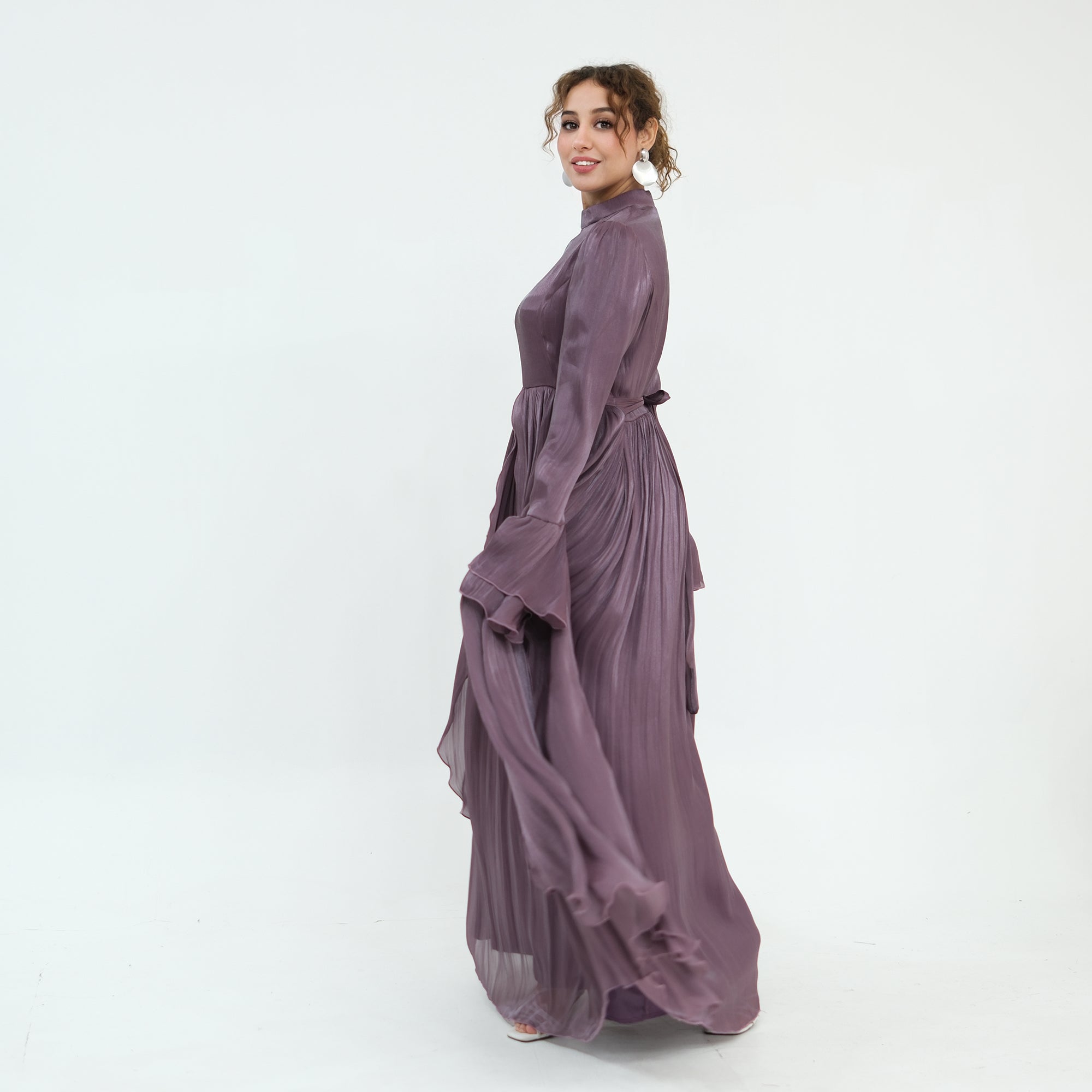Double-layered dress with a waist-hugging design and a sleeveless vest, priced at 1169, without a headscarf